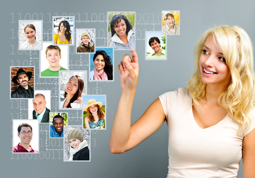 Women standing next to photos of individuals in her network